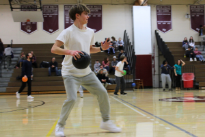  student holding a dodgeball